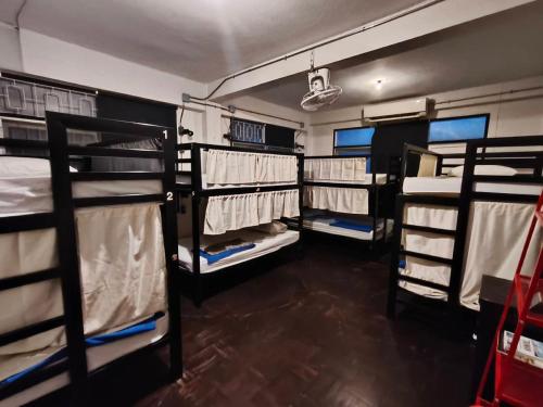 a room with four bunk beds in a room at Dreamcatcher Bangkok in Bangkok