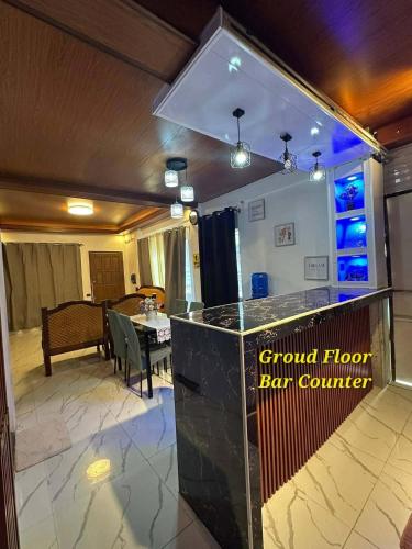 a lobby with a bar with a dining room at LALEAH Transient House in Cotabato