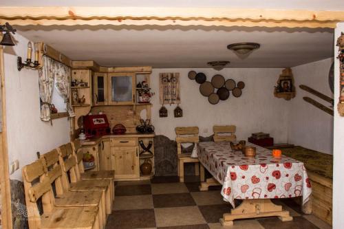 a kitchen with a table and chairs in a room at ART Chalet in Akhaltsikhe