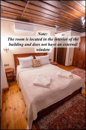 a bedroom with a bed with a quote at RAHAT Guest House in Old Town - Free Private Parking in Plovdiv