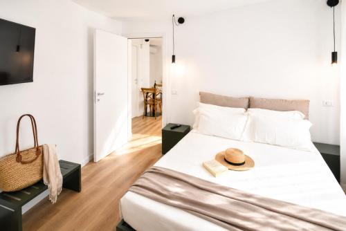 a bedroom with a bed with a hat on it at Residenza Ximenes in Palermo