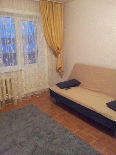Uma área de estar em Apartment on Volgogradskaya