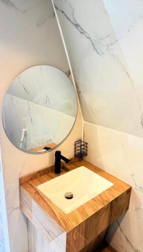 a bathroom with a sink and a mirror at سكون in Al Baha