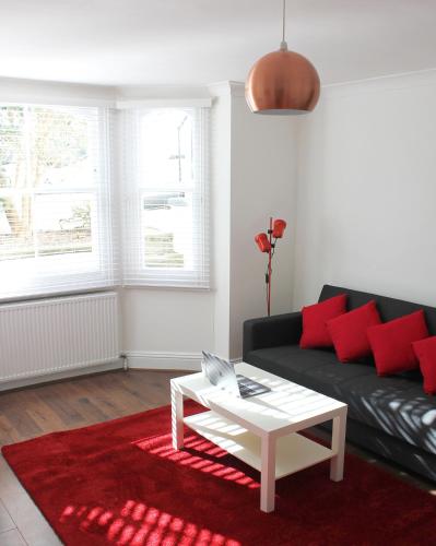a living room with a couch and a coffee table at West Hill Apartment in Brighton & Hove