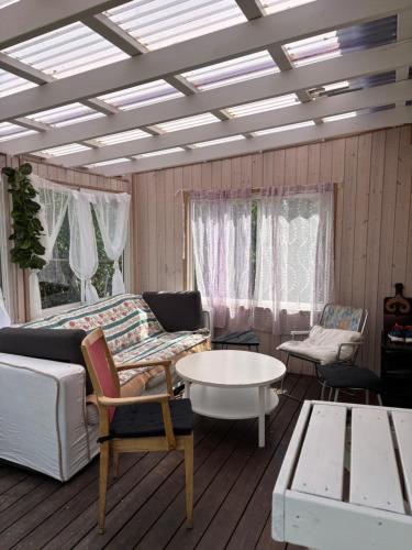 a living room with a couch and a table at Vila in Hultsfred