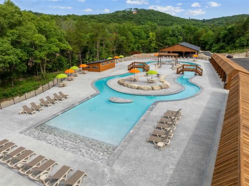 an overhead view of a resort pool with lounge chairs at Timberline Hideaway with Hot Tub in Hollister