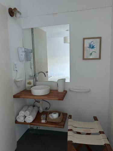 a bathroom with a sink and a mirror at Posada Las Chacras in Ciudad Lujan de Cuyo