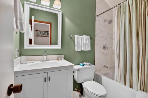 a bathroom with a sink and a toilet and a shower at Dobie 48 with Wintergreen Advantage in Wintergreen