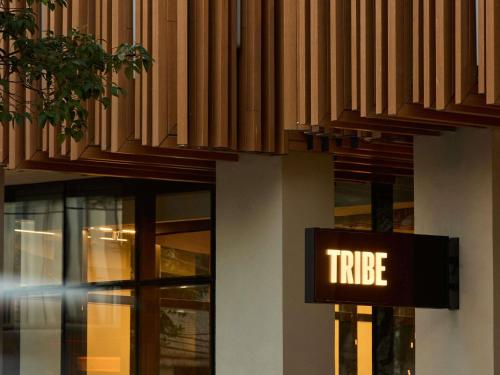 a hotel sign on the side of a building at TRIBE Belo Horizonte Savassi in Belo Horizonte