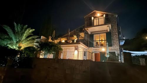 a house at night with lights on it at Villa Mila in Splitska