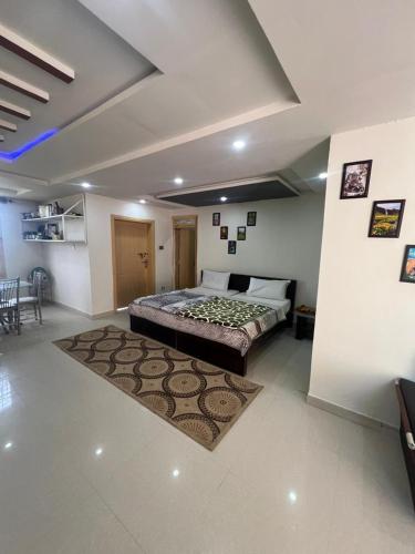 a bedroom with a large bed in a room at Nathigali A & M resort in Nathia Gali