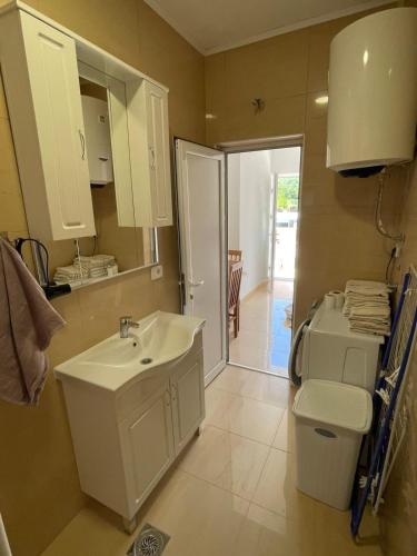 a bathroom with a sink and a toilet at Apartment with pool Tomic Boka Bay in Herceg-Novi