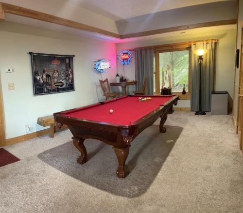 a living room with a pool table in it at Fox Crossing in Banner Elk