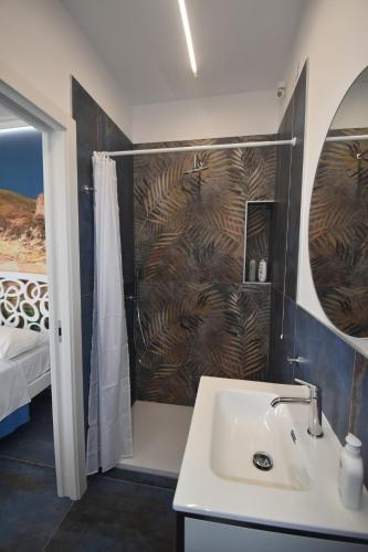a bathroom with a sink and a shower at AzzurroMare Ponza Rooms Sea View by Caseaponza it in Ponza