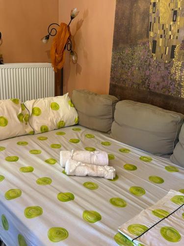 a bed with two towels on top of it at Mulberry Tree in Agia Anna