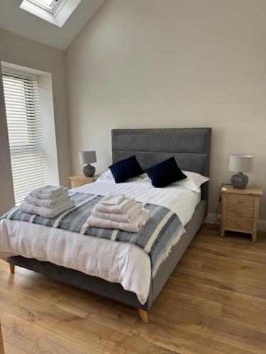a bedroom with a bed with towels on it at The Terrace Collection Number 2 in Tramore