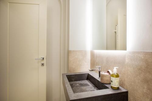 a bathroom with a sink and a mirror at B&B il Barbero in Siena