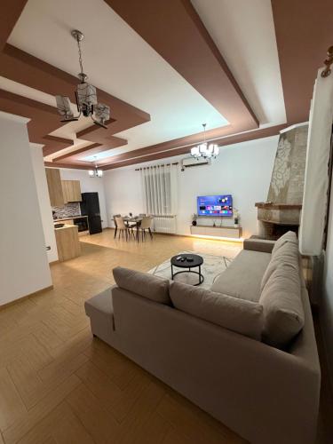 a large living room with a couch and a table at Comfort House in Bathore