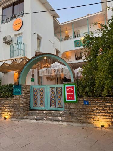a building with a window in front of a restaurant at Andoya Butik Pansiyon in Bodrum City