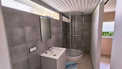 a bathroom with a sink and a toilet and a mirror at Przytulne studio 
