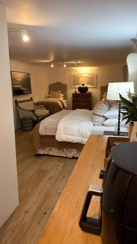 a bedroom with a large bed and a desk at 22 Emoyeni Drive in Hillcrest