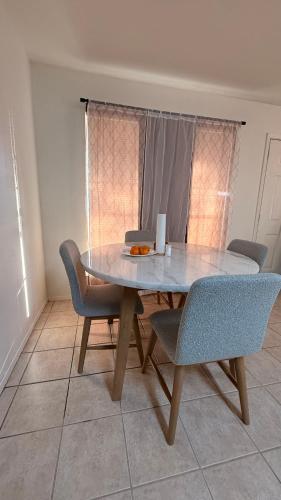 a dining table and chairs in a room at My apartment in Georgetown 2 Bedroom in Georgetown