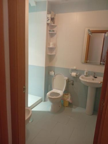 a bathroom with a toilet and a sink at Lagunas Ruidera 9 in Ruidera
