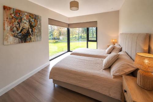 a bedroom with a bed and a painting on the wall at Sea Mourne View in Carlingford