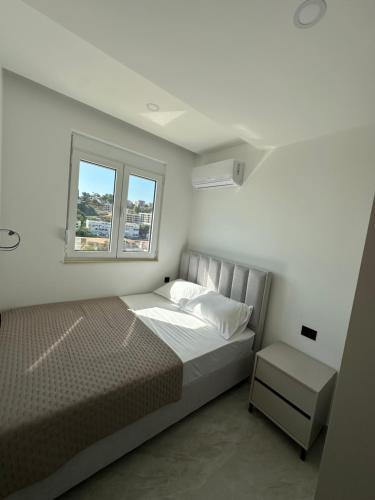 Krevet ili kreveti u jedinici u okviru objekta Kaskada Apartments Ulcinj