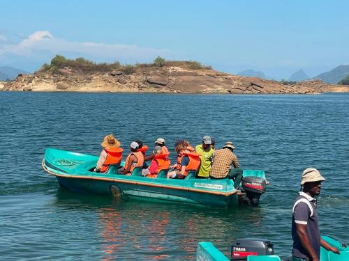 a group of people on a boat in the water at Galoya Red Lotus in Ampara