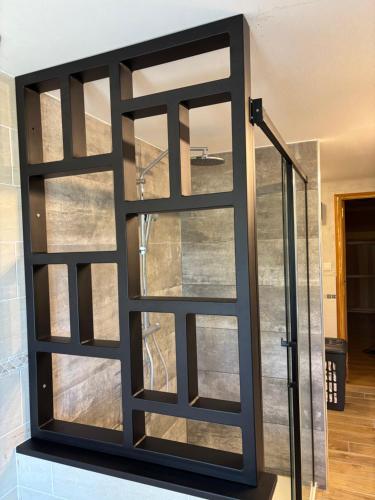 a sliding glass door in a room at Chez Phil et Marie in Pralong