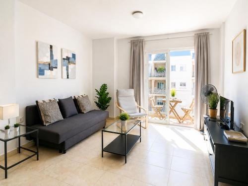 a living room with a couch and a table at Candelaria ocean views in Candelaria