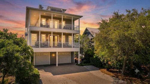 a large house with a balcony and trees at Blue Mountain View - Private Pool in Santa Rosa Beach