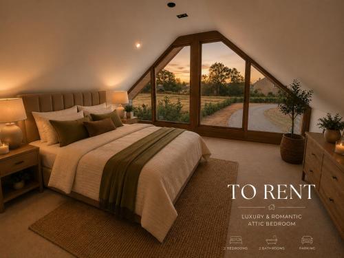 a bedroom with a large bed and a large window at Blackberry Barn in Baltonsborough