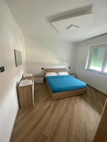 a small bedroom with a bed and a window at Cantalupo30 in Cantalupo