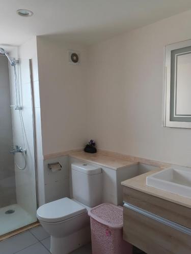 a bathroom with a toilet and a sink at Chalet Marina 2 Marassi in El Alamein