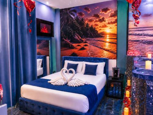 a bedroom with a bed with two swans on it at Napoli in relax in Naples