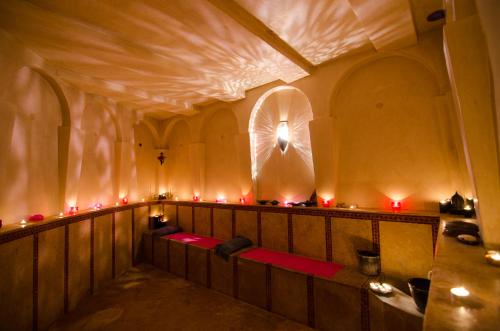 a room with red lights in a building at Lodge K in Marrakech
