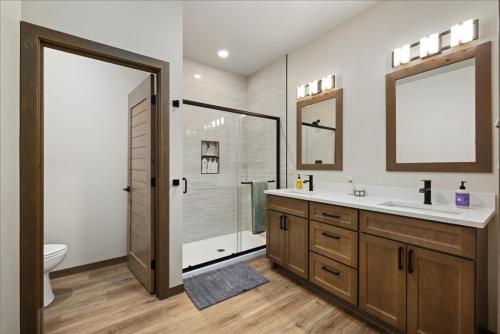 a bathroom with a shower and a sink and a toilet at Evergreen Retreat Red Lodge in Red Lodge
