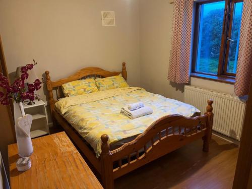 a bedroom with a bed with towels on it at 2 bedroom house 