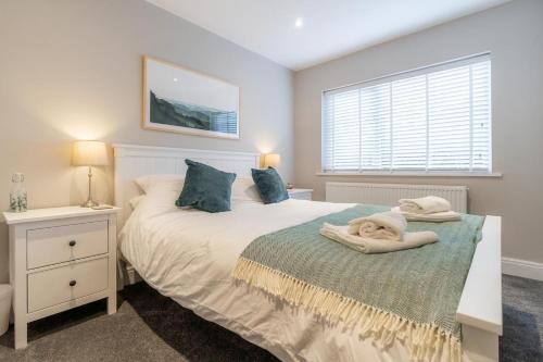 a bedroom with a bed with towels on it at 1 Bed in Grasmere oc-lr068 in Grasmere