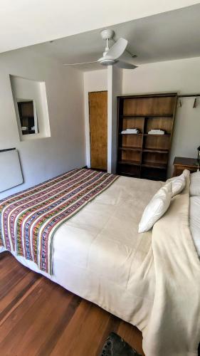 a large white bed in a room with wooden floors at Elvi&Vi in La Rioja