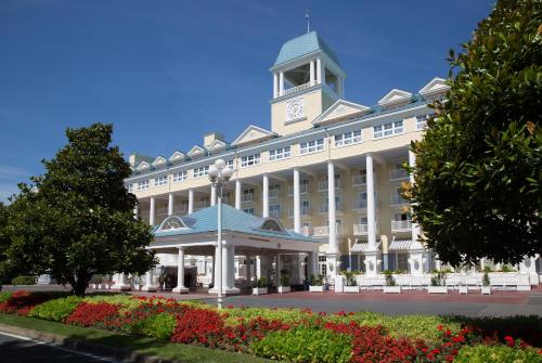 a large white building with a clock tower on top at Disney Newport Bay Club in Chessy
