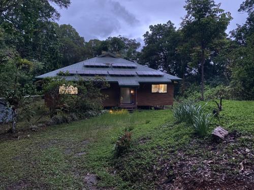 a small cabin in the middle of a field at Daintree Private Escape in Cow Bay