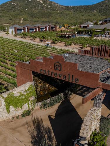 a sign for the entrance to a winery at Entrevalle Hotel Boutique in Valle de Guadalupe