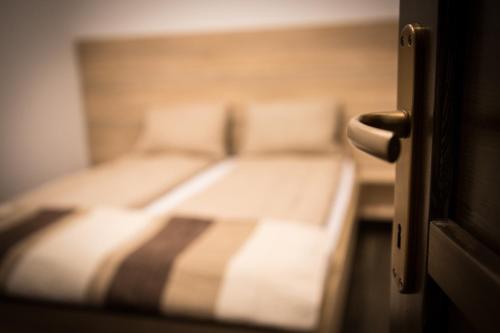 a blurry picture of a bed in a room at Relax Apartmanház in Mórahalom