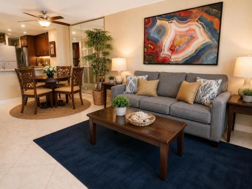 a living room with a couch and a table at Mahana 604 Oceanfront 1BD 1BA condo in Kahana