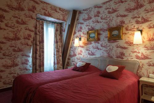 Säng eller sängar i ett rum på Neuilly Park Hotel