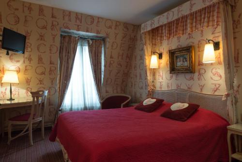 Ένα ή περισσότερα κρεβάτια σε δωμάτιο στο Neuilly Park Hotel