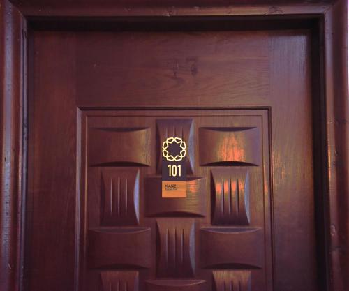 a wooden door with two lights on it at Z Pyramids view Hotel in Cairo